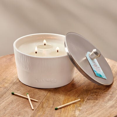 Thymes Aqua Coralline 3-Wick Candle on table